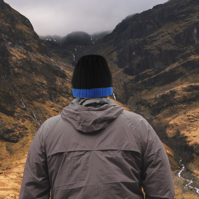 Waterproof beanie mountains background